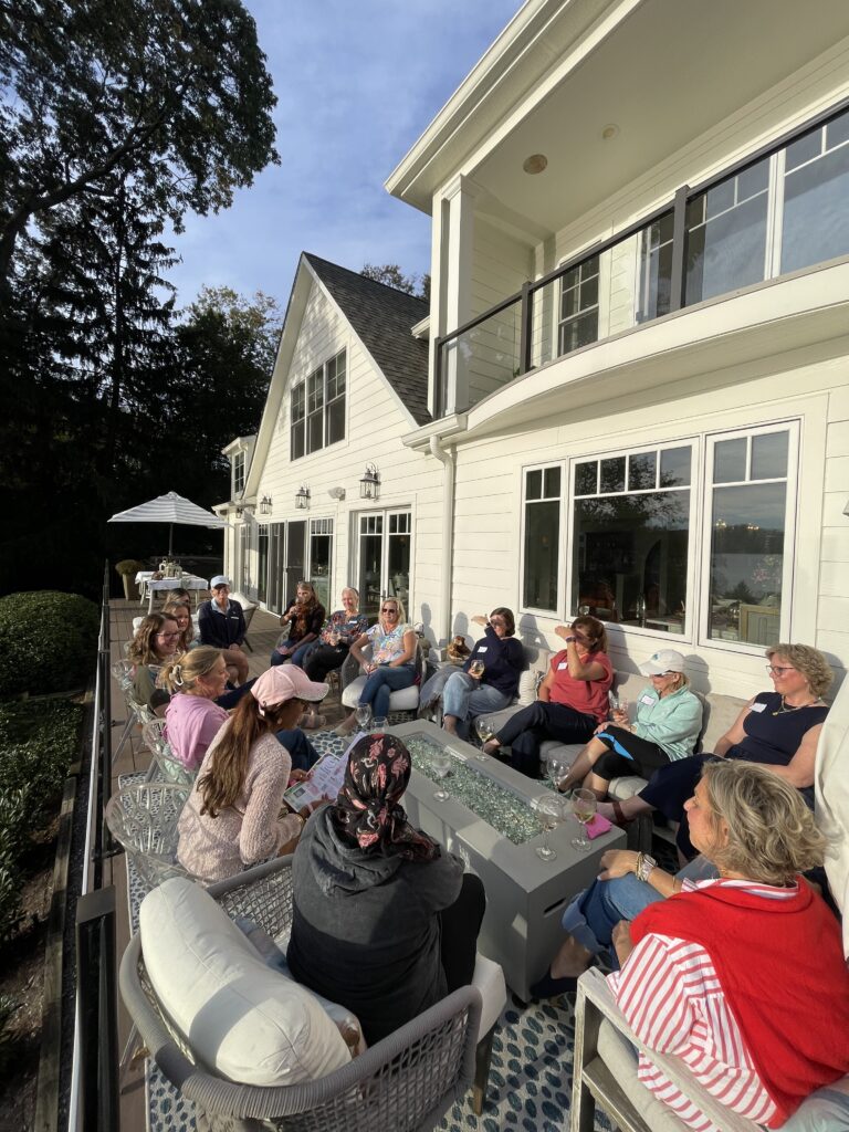 Where it all began. A group of Breasties gather on a porch to talk.